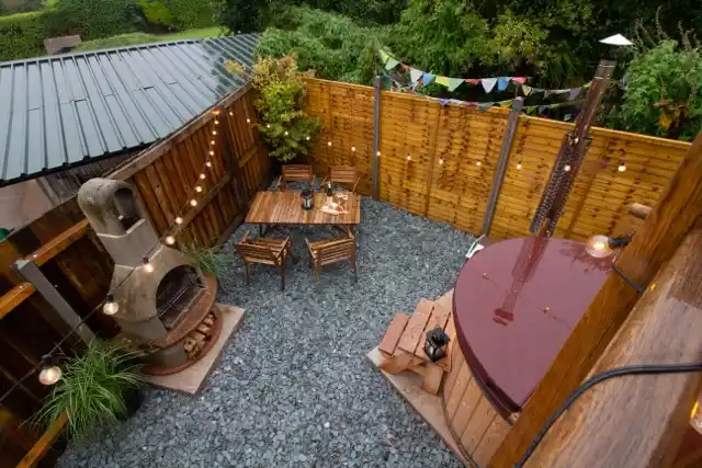 Private alfresco terrace at The Studio Cheddar with outdoor dining area and open Mendip Hills countryside views — exclusive dog-friendly luxury lodge near Cheddar Gorge, Somerset